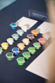 Numbered acrylic paint pots in greens, blues and warm tones from the Swing paint by numbers kit