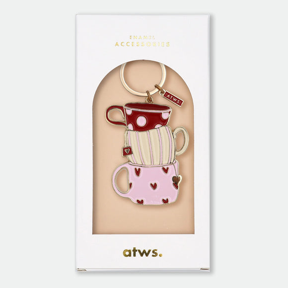 Enamel and metal keychain of three stacked teacups in red polka dot, cream stripe, and pink heart patterns, gold-tone ring and "ATWS" charm