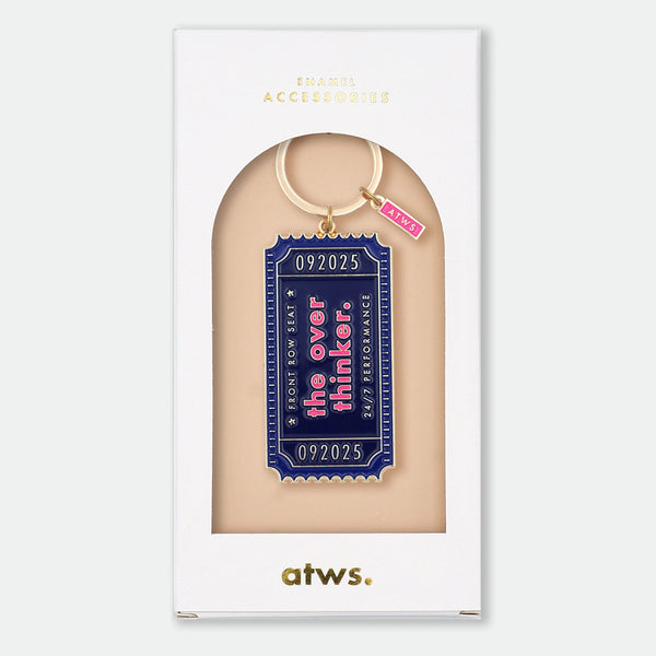 Enamel and metal keychain shaped like a vintage show ticket, navy with pink text reading "092025, Front Row Seat, The Overthinker, 24/7 Performance," gold-tone ring and "ATWS" charm
