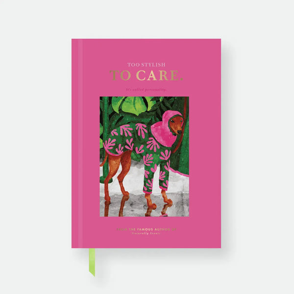 Too Stylish To Care hardcover A5 notebook by All The Ways To Say, hot pink cover styled like a book jacket with the title "Too Stylish To Care, it's called personality," a fake author credit, and an illustration of a dachshund wearing a leaf-print hooded raincoat