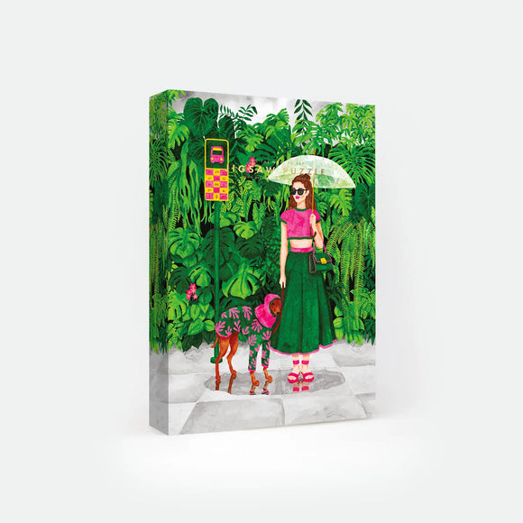 Wet Season 1000-piece jigsaw puzzle box by All The Ways To Say, illustration of a woman with an umbrella and her dog in a raincoat standing at a jungle bus stop, text reads "Jigsaw Puzzle".