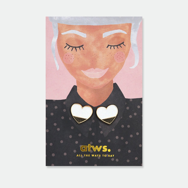 Set of two matching white and gold enamel pins shaped like hearts, each split cleanly in half, designed to be worn on either side of a shirt collar